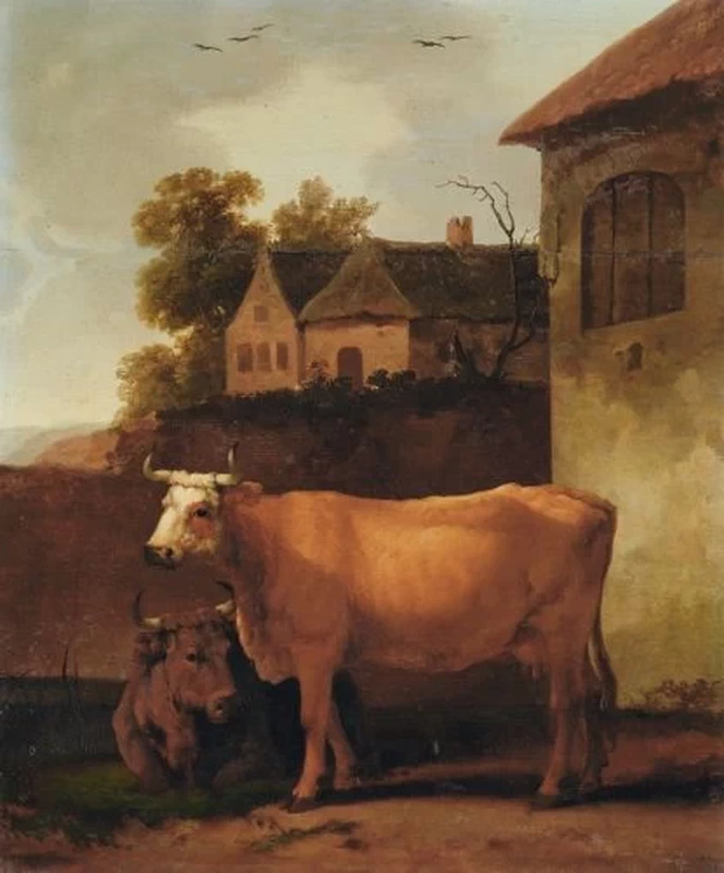 Due mucche vicino ad un edificio